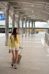 Naklejka premium young Asian woman visit Bangkok city