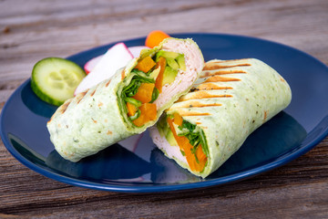 smoked turkey meat  in a pesto wrap tortilla sandwiches