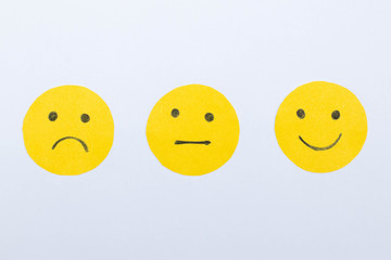 Cut out of paper smiles mood on a white background