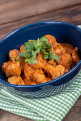 indian butter chicken dish with cilantro on top