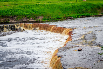 Sablinsky waterfalls. Little waterfall. The brown water of the waterfall.. Thresholds on the river....
