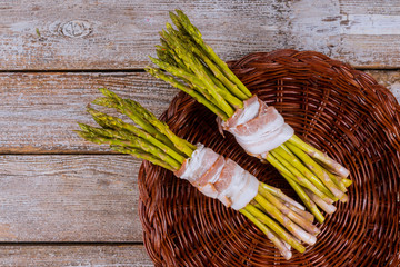 Green organic asparagus wrapped with rolled in bacon