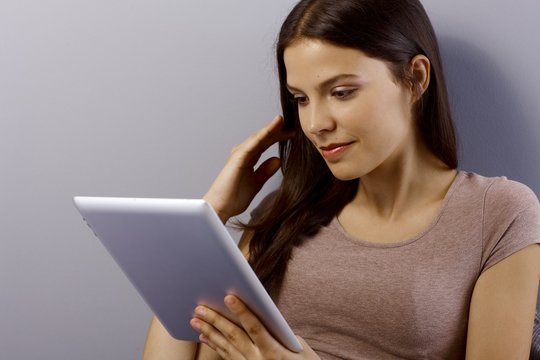 Closeup young woman with tablet computer