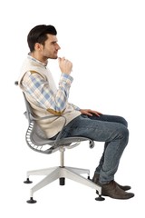 Side view of businessman in swivel chair