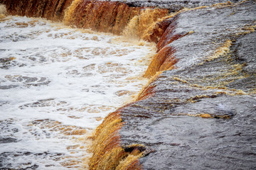 Sablinsky waterfalls. Little waterfall. The brown water of the waterfall.. Thresholds on the river....