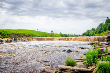 Sablinsky waterfalls. Little waterfall. The brown water of the waterfall.. Thresholds on the river....