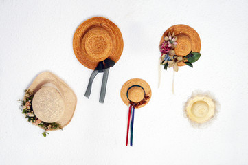 Straw hats on a wall