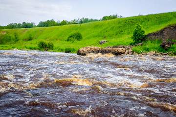 Sablinsky waterfalls. Little waterfall. The brown water of the waterfall.. Thresholds on the river....