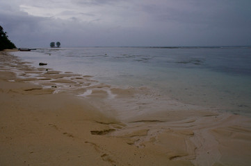 Fototapeta na wymiar Low Tide on the beach during the storm, La Digue Island, Seychelles