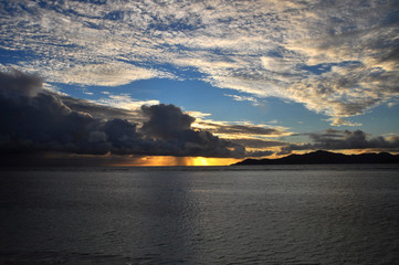 Sunset of the Island of Praslin from La Digue Island, Seychelles