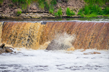 Sablinsky waterfalls. Little waterfall. The brown water of the waterfall.. Thresholds on the river....