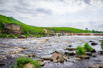Sablinsky waterfalls. Little waterfall. The brown water of the waterfall.. Thresholds on the river....