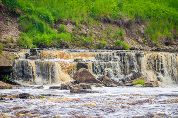 Sablinsky waterfalls. Little waterfall. The brown water of the waterfall.. Thresholds on the river....