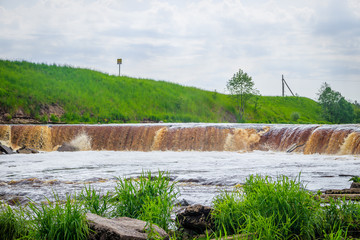 Sablinsky waterfalls. Little waterfall. The brown water of the waterfall.. Thresholds on the river....