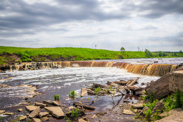 Sablinsky waterfalls. Little waterfall. The brown water of the waterfall.. Thresholds on the river....
