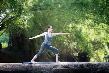 Fototapeta na wymiar Woman practice yoga with nature background