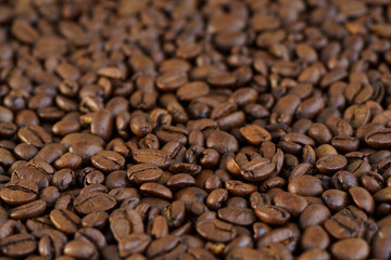 Roasted coffee beans on a table. Selective focus, high resolution