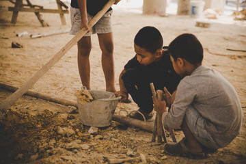 Against child labor, Poor children, construction work, labor work in the construction site,  Violence children and trafficking concept