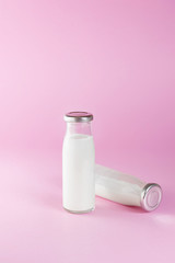 bottle of milk on  pink background