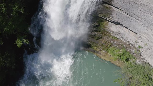 Aerial top down shot of Golfarone Waterfall hitting the water surface of a pool along Secchiello stream in Val d&rsquo;Asta in Reggio Emilia in Italy.