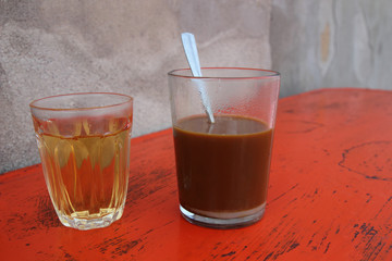 Hot coffee with hot tea on the table