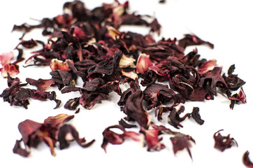 Hibiscus tea. Herbal tea.  Dry tea leaves isolated on white background