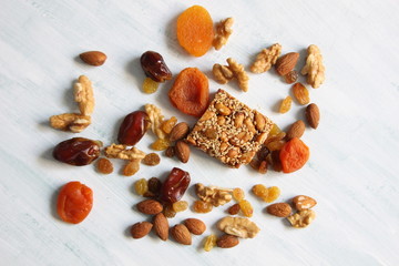 Bunch of nuts, sweets, dried fruits on white background