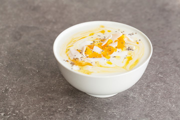 Mango smoothies bowl with coconut and Chia seeds. Vegan diet food concept. Healthy breakfast. 