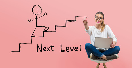 Next level concept with young woman using her laptop