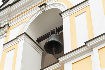 Fototapeta na wymiar Church bell. The metal bell inside the tower. Bell ringing