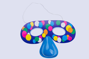 Blue eye mask for kids Birthday celebration. Toy accessory for children over white background, studio shot.