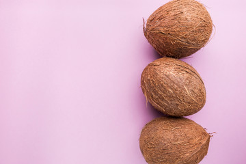 coconuts on pink background.