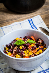Chili corn carne on wood table