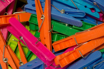 A handful of clothespin to hang clothes of various colors