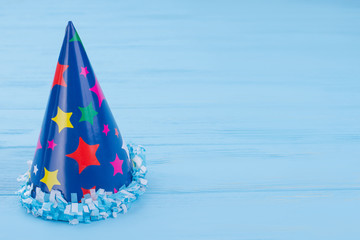 Party paper cone hat with copy space. Birthday party cap for kids and adults, text space. Festival event supply.