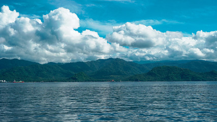 Sunny day with clouds in the sea