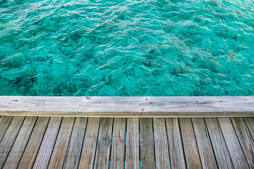 wooden balcony on the beautifully clear sea in the Maldives