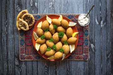 Traditional Arabic kibbeh with lamb and pine nuts