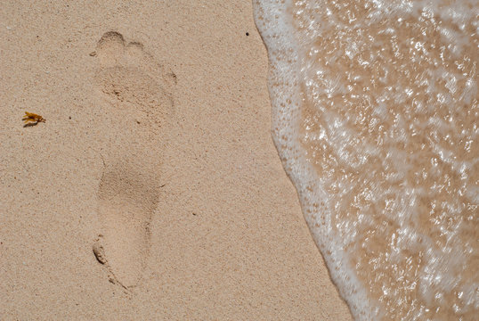 Imprint of a foot in the sand of the beach, taken at Tulum in the Mexican Yucatan peninsula