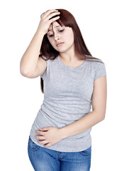 Fototapeta premium young girl with headache stomachache pain madicine health care