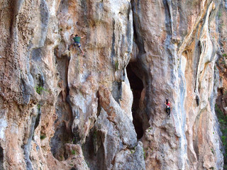 Rock climbing man and girl in Turkey, Geyikbayiri Route Trebenna,