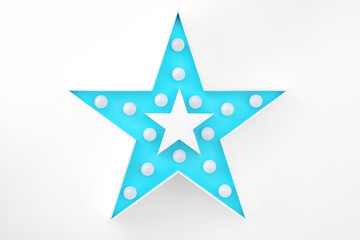 blue decorative star with lots of lights on white background