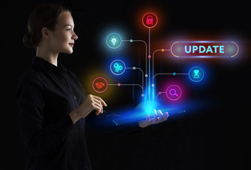 The concept of business, technology, the Internet and the network. A young entrepreneur working on a virtual screen of the future and sees the inscription: Update