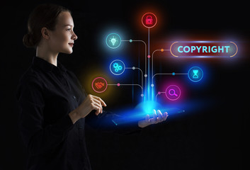 The concept of business, technology, the Internet and the network. A young entrepreneur working on a virtual screen of the future and sees the inscription: Copyright