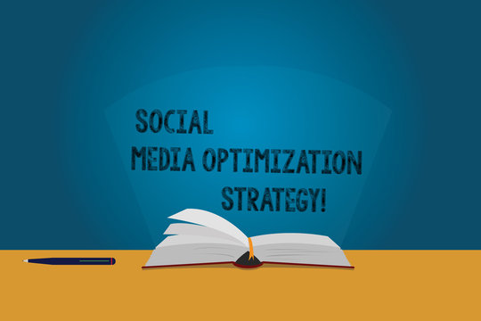 Handwriting text Social Media Optimization Strategy. Concept meaning SEO Advertising Marketing strategies Color Pages of Open Book photo on Table with Pen and Light Beam Glaring
