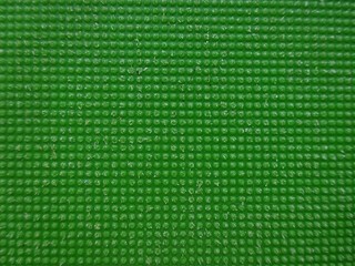 Green color textured plastic bubble ribbed texture surface background 