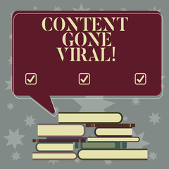 Conceptual hand writing showing Content Gone Viral. Business photo showcasing image video link that spreads rapidly through population Uneven Pile of Hardbound Books and Rectangular Speech Bubble