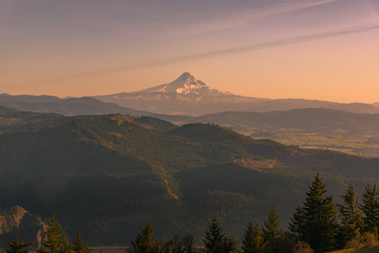 Rare view of Oregon's Mt Hood over layers of hills and earth at sunset