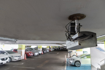CCTV security camera in parking lot security cars. Security Concept.