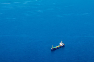 Cyprus. Cargo ship on the water view from a height. Mediterranean sea. Cyprus Navy. Sea routes of...